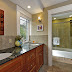 The master bath includes 2 sinks and a 2-headed shower with 3 massage jets.