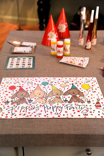 I illustrated place mats with my daughter's name and puppies, which decorated the tables. I also sent out invitations and made favors using my illustrations.
