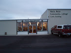 Outside the shop, parking lot view