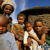 Curious Besotho children crowd around me.
