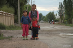 Three children pose in Kochkor