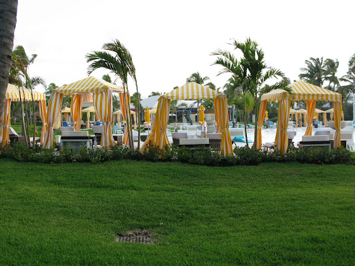 Cute cabanas around the pool. The little tables next to them have hidden coolers to keep your beverages chilled.