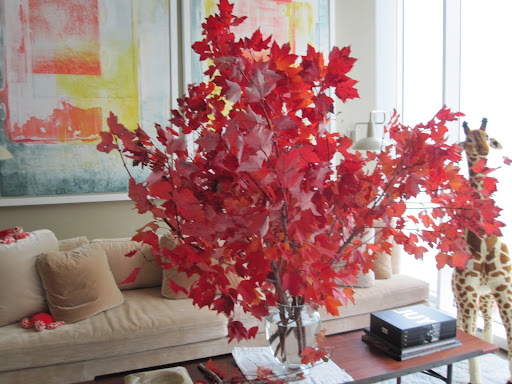 When deciding where to place such a large arrangement, be sure to think of where your guests are most going to be. This piece may not be the best to put on a dining room table because people will not be able to see over it (unless you did a smaller version of this arrangement).