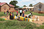 Women collecting water from local water bore