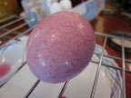 The beet dyed eggs were pink and speckled.