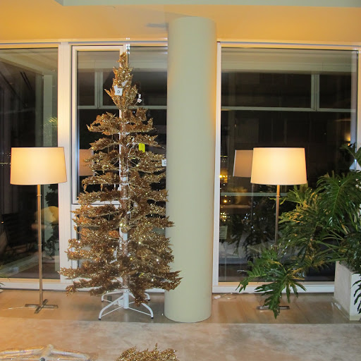The first tree has been put together but no ornaments have been added.