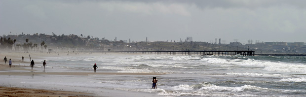 People walking along Venice Beach, California. Much of Venice Beach and other local coastal areas could be significantly eroded or flooded by the year 2100 if ocean levels continue rising at current rates, according to a state-commissioned economic study released today by San Francisco State University. Gabriel Bouys / AFP / Getty Images