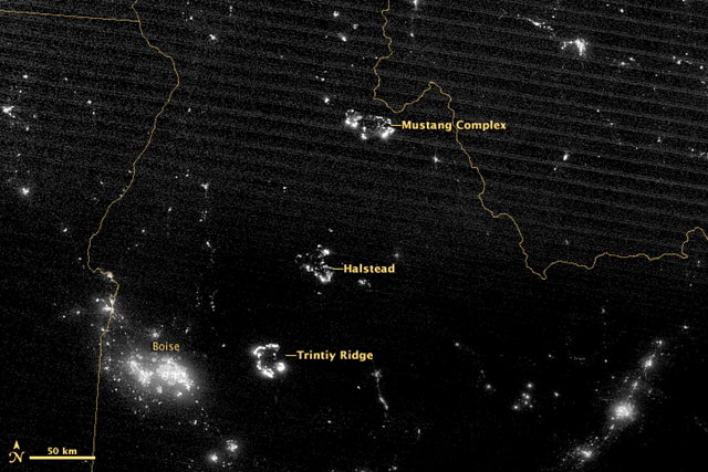 On 17 August 2012, the Visible Infrared Imaging Radiometer Suite (VIIRS) on Suomi-NPP acquired this image of wildfires blazing in the western United States. The brightest fires are white; smoke is light gray. This image shows three of the largest fires burning in Idaho. NASA image by Jesse Allen, using Suomi NPP VIIRS data