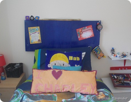 Charley's headboard/noticeboard Blue headboard, noticeboard, canvas, spray paint