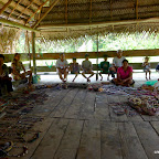 A small village and their crafts.  THe girls buy bracelets and we buy 3 ant-infested blowguns.