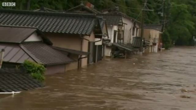 Floodwaters sweeps through homes and streets in the southern island of Kyushu, Japan, 14 July 2012. More than 75cm (30in) of rain fell in 72 hours in the city of Aso, in Kumamoto prefecture. BBC