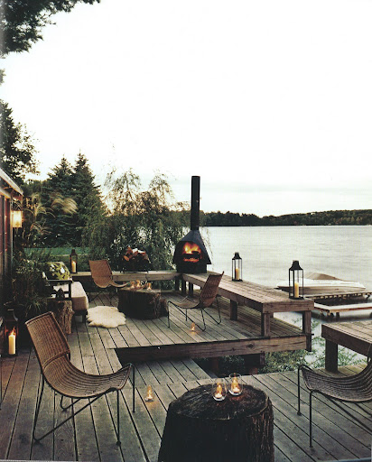 This outdoor space incorporates indoor elements such as a daybed outfitted with cushions and a sheepskin rug. This outdoor space incorporates indoor elements such as a daybed outfitted with cushions and a sheepskin rug.