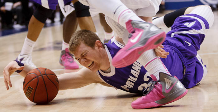 Portland forward Ryan Nicholas (32) dives for a loose ball. BYU vs. Portland, college basketball Saturday, February 25, 2012 in Provo, Utah.