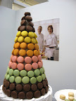 The co-owners of Mad Mac watch over their tower of sweetness.