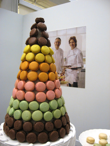 The co-owners of Mad Mac watch over their tower of sweetness.