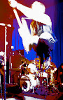 Mike Dirnt of Green Day levitates off the Uptown stage
