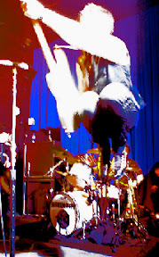 Mike Dirnt of Green Day levitates off the Uptown stage