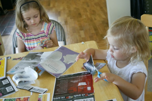 Have your children flip through grocery store circulars or old magazines to find images they love. My 8- and 6-year-old were able to cut out each picture on their own, but I helped my 3-year-old with the cutting.