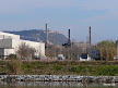Smokestacks and Montjuic from the Llobregat