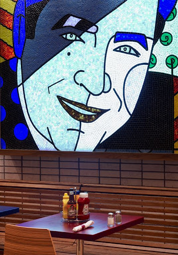 Burgers and More by Emeril in Pennsylvania. A pop art mosaic of Emeril kicks up the impact of the dining area. Burgers and More by Emeril in Pennsylvania. A pop art mosaic of Emeril kicks up the impact of the dining area.
