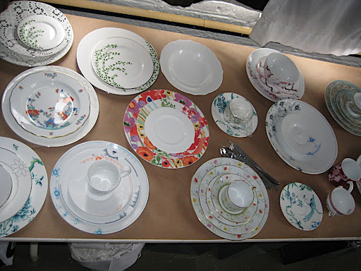 Here is a portion of a table of floral patterned plates.