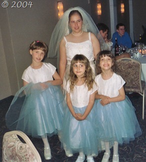 The beautiful bride with her three young cousins