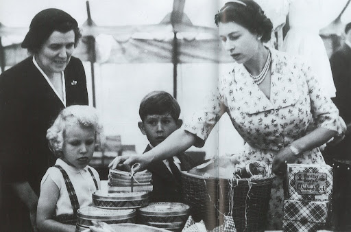 H.M Queen Elizabeth II with Princess Anne, Prince Charles, and their nurse, Helen Lightbody at a stall during a Sale of Work event in Abergeldie Castle, near Balmoral. They are raising funds for the building of a new vestry at Craithie Church. H.M Queen Elizabeth II with Princess Anne, Prince Charles, and their nurse, Helen Lightbody at a stall during a Sale of Work event in Abergeldie Castle, near Balmoral. They are raising funds for the building of a new vestry at Craithie Church.