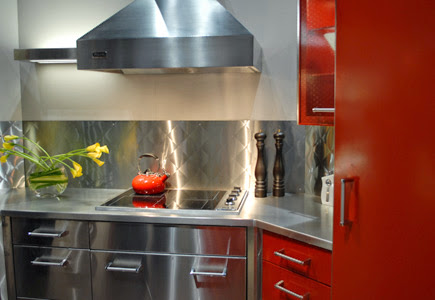 Stainless steel cabinets in metallic and red finishes.