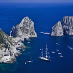 Italy, Campania, Capri island, view of the island rocky coastline and Faraglioni Rocks