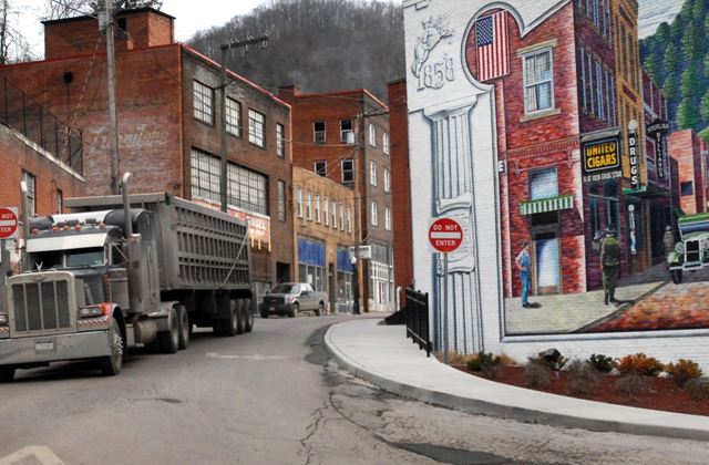 In this 9 February 2011 photo, a coal truck drives out of downtown Welch, West Virginia. A record number of U.S. counties - more than 1 in 3 - is now dying off, hit by an aging population and weakened local economies that are spurring young adults to seek jobs elsewhere. 2012 census estimates highlight the population shifts as the U.S. encounters its most sluggish growth levels since the Great Depression. In the last year, Maine joined West Virginia as the only two entire states where deaths exceed births, which have dropped precipitously after the recent recession. Photo: Jon C. Hancock / AP