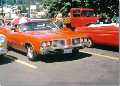 45 1972 Oldsmobile Cutlass Convertible in the Rainier Shopping Center parking lot for Rainier Days in the Park on July 13, 1996