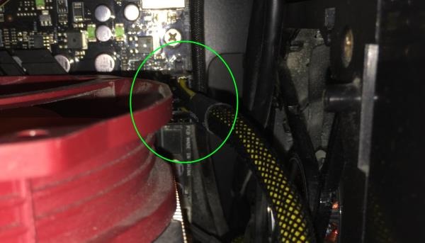 Picture of the EPS power cable connected to the 8-pin socket on the motherboard