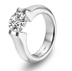 Designer Stephen Kretchmer is renowned for his sleek tension settings, as in this platinum and diamond engagement ring.