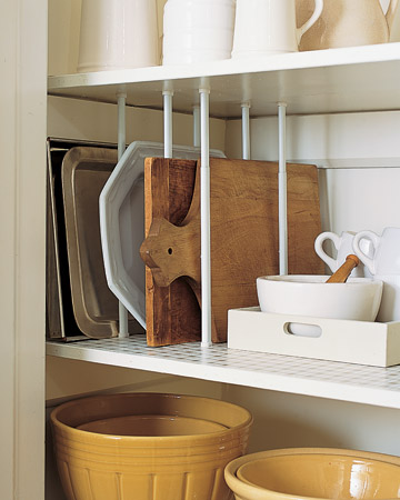 I use this trick in my cupboards at home. Create dividers for them using tension curtain rods. Buy rods to fit the space, and position pairs of them at intervals. Twist to tighten. I use this trick in my cupboards at home. Create dividers for them using tension curtain rods. Buy rods to fit the space, and position pairs of them at intervals. Twist to tighten.
