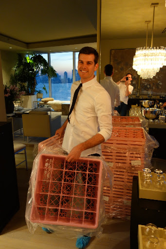 Treavor, bartender extraordinaire unpacking glasses and setting up the bar.