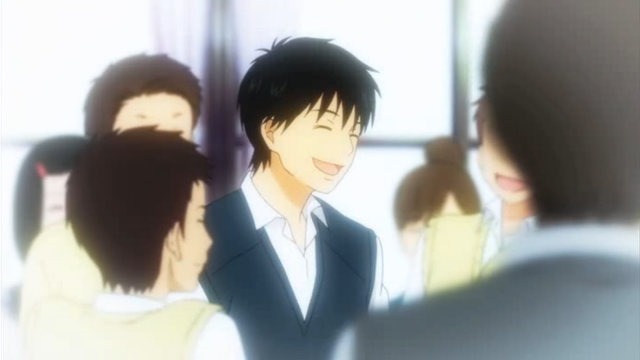 Kazehaya laughs in a circle of classmates and friends