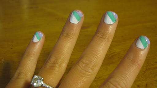 Wait another five minutes, then apply your final color to the corner of your nail. Don't worry if some polish gets on your cuticles or skin -- you can always dip a cotton swab in nail polish remover to clean up any rough edges.