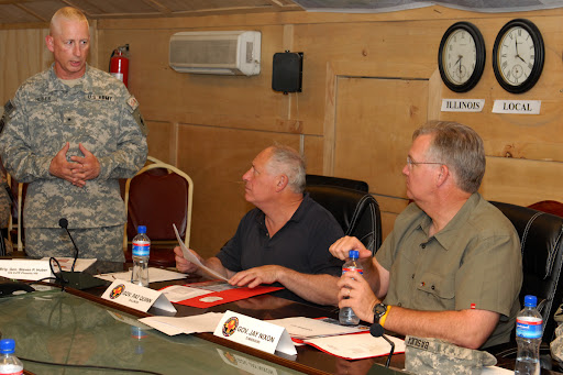 Gov. Jay Nixon (right) and Gov. Patrick Quinn, of Illinois (center), listen as Brigadier Gen. Steven P. Huber gives a briefing on Task Force Phoenix in Afghanistan on July 20.  Gen. Huber is the commander of Combined Joint Task Force Phoenix VIII.  The Task Force includes nearly 8,000 soldiers who are training and mentoring Afghan military and police forces. (photo courtesy: U.S. Department of Defense)