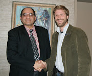 Ben greets El Salvador's Ambassador to Canada during a meeting in Victoria