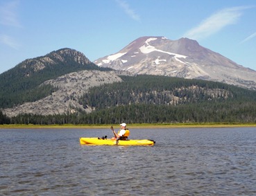Vic kayaking at Sparks Lake with 5000 ft. peak of South Sisters in the background