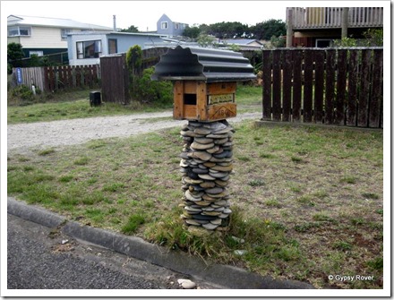 Novel mail boxes at Koitiata, Turakina. Beer crate lined with flattened beer can's.