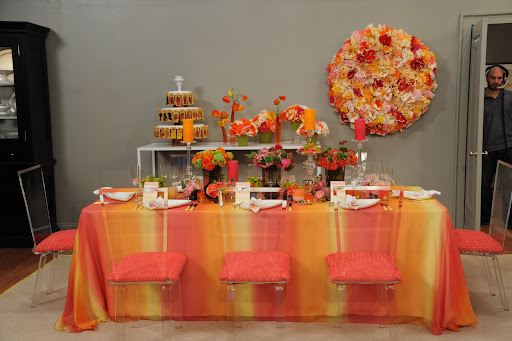 Bryan's own take on color for our set including a pretty ombré tablecloth and lots of bright flowers and candles.
