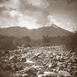 View from a dry and rocky riverbed towards the Salak volcano (Georg Friedrich Johannes Bley, 1920s) View from a dry and rocky riverbed towards the Salak volcano (Georg Friedrich Johannes Bley, 1920s)