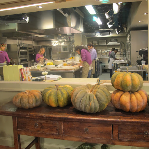 Action! Now that the episode is being filmed live, all the kitchen workers have suited up in purple shirts. Martha is all about the details.