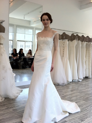 This gown can be worn with or without a peplum -- a great option if you want a quick change for your reception.