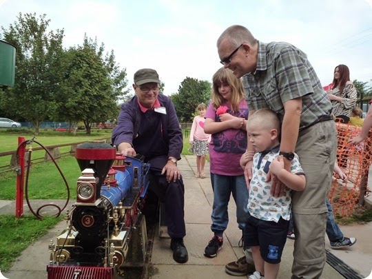 Olivia aged 8 - Luke 4 and Uncle Mark inspect the locomotive after their ride