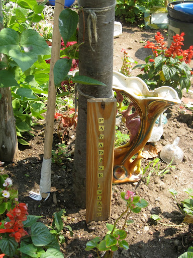 This gardener has named each planted area in keeping with her theme. This one is 