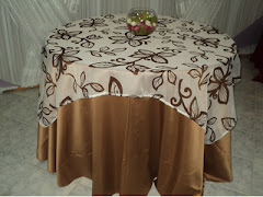 Album (digital) de fotos de Sobre Toalha de Voil Estampado da empresa de toalhas e tecidos Tropical Toalhas, que vende tecidos, toalhas, capas de cadeira e guardanapos para festas e eventos; toalha redonda longa, sobretoalhas (sobre-toalhas), toalhas especiais, sobrecapas (sobre-capas), caminho de mesa, capas de almofadas e aventais, nos tecidos cetim podange, gorgurao, shantung (xantungue), voil liso, voile bordado, voal estampado, jacard (jacquard), panama gold, e em estilos matelasse, fanstasminha, princesinha, fraque, em diversos formatos e tamanhos. tecidos para decoração rio de janeiro rj venda festa eventos toalha redonda tecido loja capa cadeira caminho mesa almofada capas cadeiras lojas panamá cetim podange fotos decoracao 15 anos igrejas