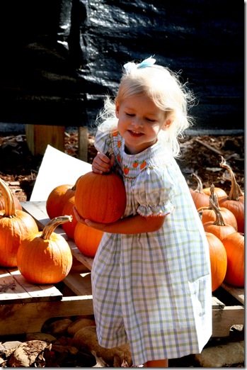 Cori carrying pumpkin