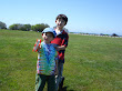 Eidan and Kai flying a kite at Brenton Point in Newport